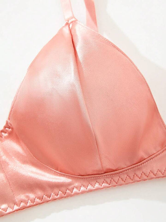 Close-up of a pink bra on a white background