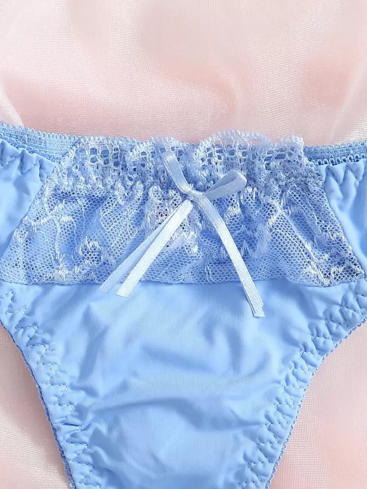 Blue lace-trimmed underwear on a blurred background