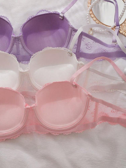 Pink and purple bras on a white background